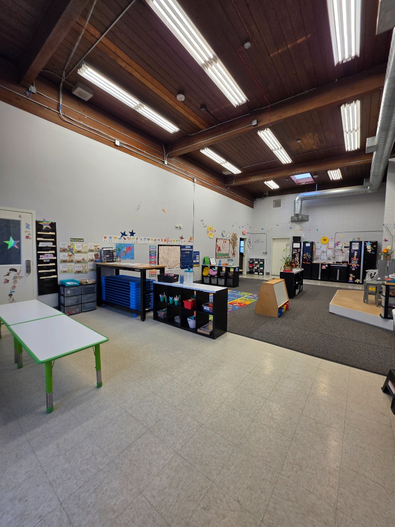 Harwell School Beaverton indoor 1,000 sq ft play space and movement studio with timber beam ceiling